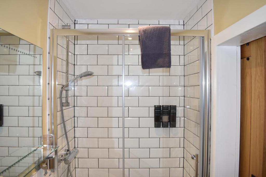 Tiled ensuite shower room in one of the letting pods