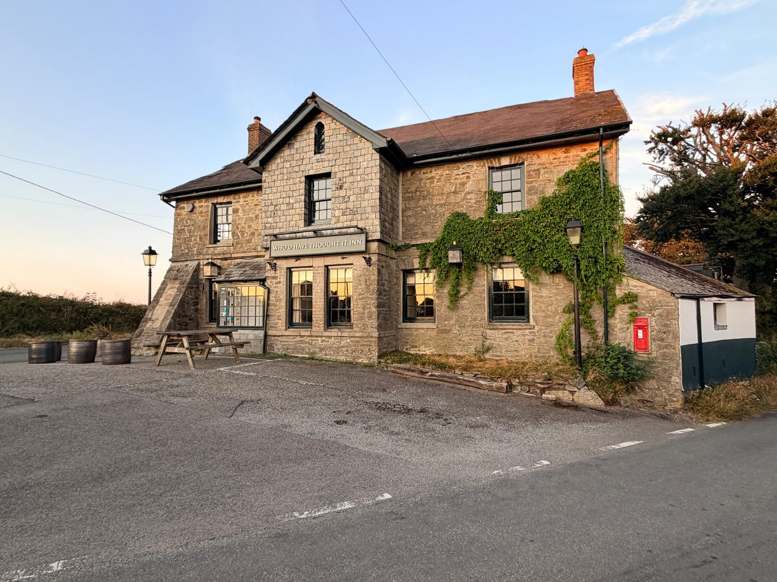 Who'd Have Thought It Inn, a stone country pub in St Dominick, Cornwall, at sunset