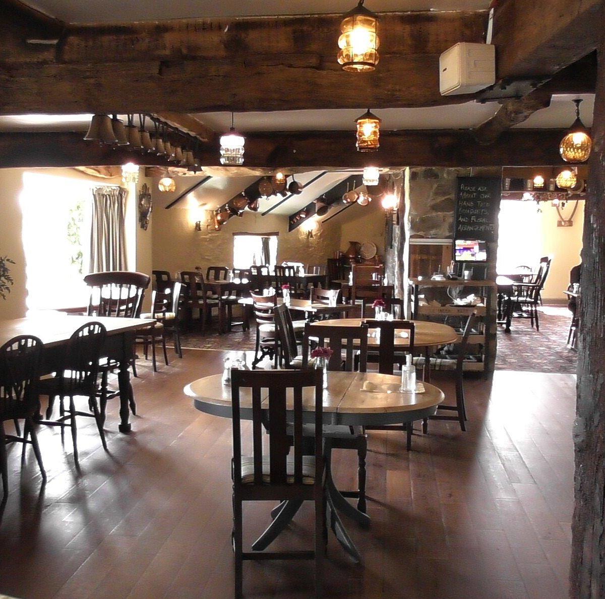 The beamed restaurant at Who'd Have Thought It Inn, set for dinner